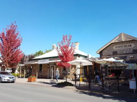 a building with a store on the corner of a street