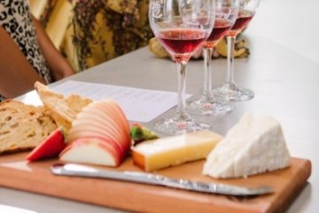 a person sitting at a table with a plate of food