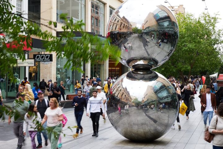 a group of people walking down the street